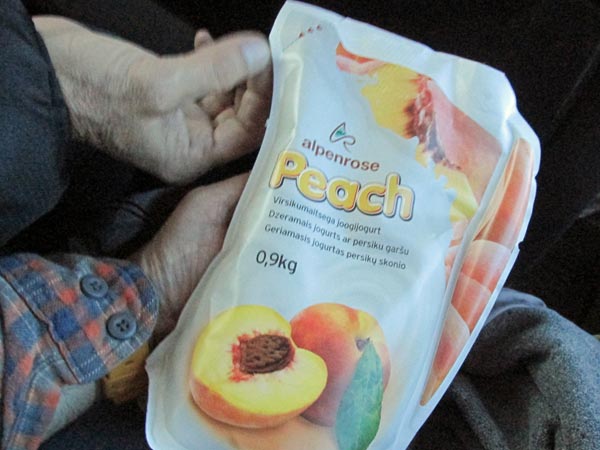 mike watt handling some yogurt (tom watson's hand above his) in marijampole, lithuania on may 18, 2015