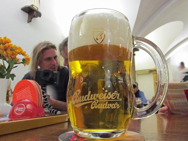 adam + pepa behind mug of 'real budweiser' beer watt drank at budweiser budwar brewery in ceska budejovice, czech republic on may 28, 2015