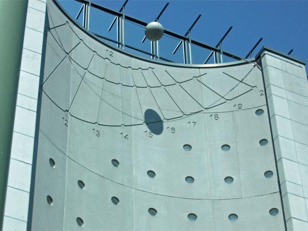 sundial on building in downtown brussels, belgium on june 5, 2015