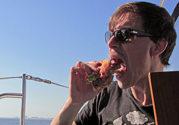 andrea belfi chowing burger on 'the sandbar' off biloxi, ms on october 26, 2014