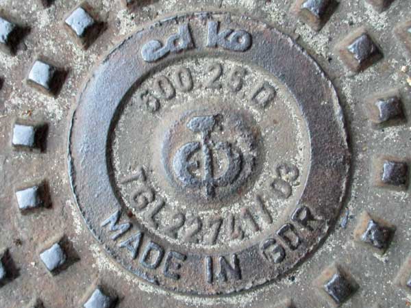 ddr era manhole cover outside andrea belfi's prac pad in the rummelsburg part of berlin, germany on september 27, 201