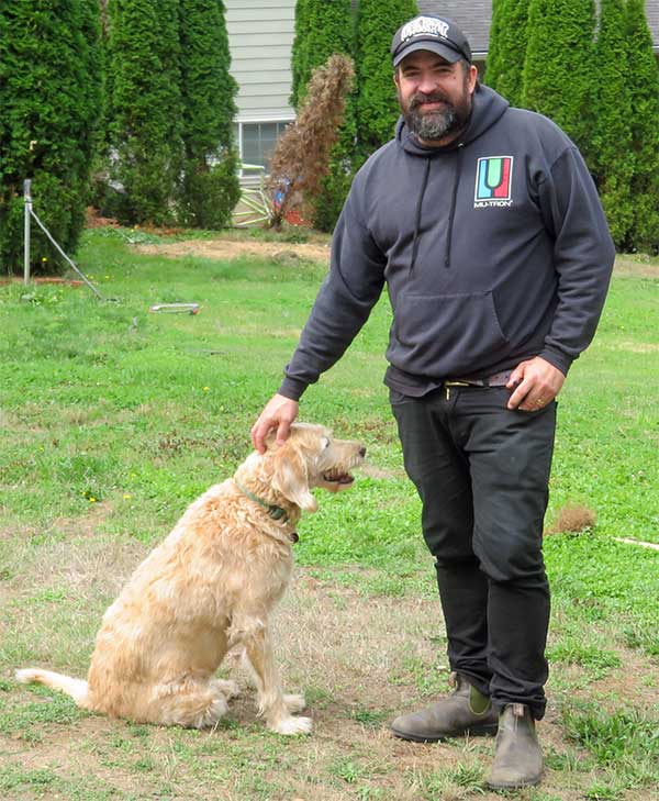 chris benson w/his dog molly in oregon city, or on september 11, 2023