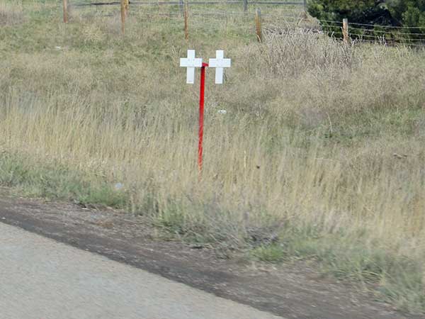 roadside crosses marking traffic deaths on I-90 in western montana