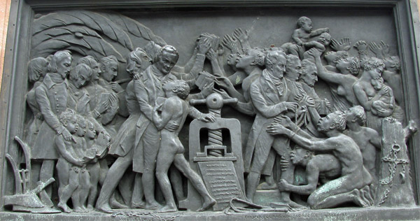 one side of base of gutenberg statue in strasbourg, france