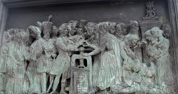 one side of base of gutenberg statue in strasbourg, france