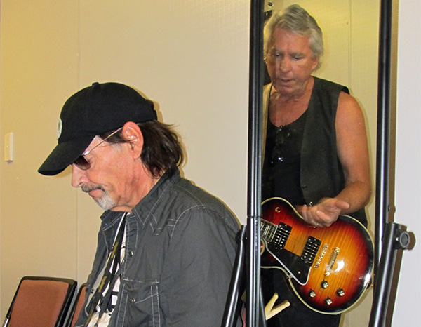 scott asheton (left) + james williamson (in mirror) backstage warming up for the  'big day out' gig in sydney on jan 26, 2011
