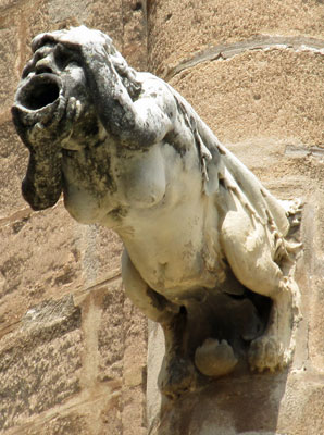 gargoyle on the side of saint mary's cathedral in seville, spain