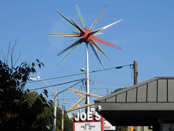 sign for 'joe's wines' near 'martin music' in memphis, tn on october 19, 2015