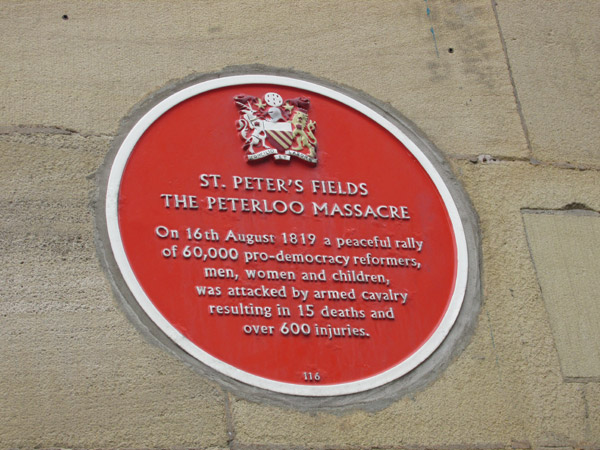 peterloo massacre memorial plaque on the 'free trade hall' in manchester, england on april 13, 2014