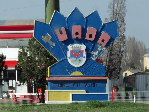 approaching welcome sign for turda, romania on march 29, 2014